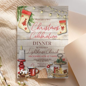 May include: A Christmas Celebration Dinner invitation with watercolor illustrations. The design features a wooden background, Christmas stockings, a candle, and festive food items. The invitation includes the text "Please join us for a Christmas Celebration Dinner".