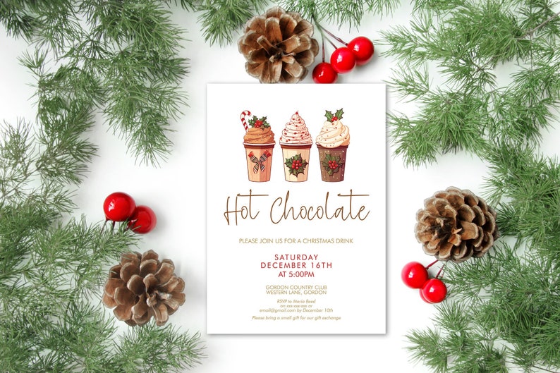 May include: A white invitation card with the text "Hot Chocolate" in brown script, featuring illustrations of three hot chocolate cups with whipped cream and holiday decorations. The card is surrounded by pine branches, red berries, and pine cones.