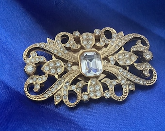 Vintage brooch by Sphinx. Gilt metal with clear stones