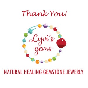 May include: A white background with the words "Thank You!" in red script. A circular design of colorful beads surrounds the text "Lyvi's gems" in red script. Below, the text reads "NATURAL HEALING GEMSTONE JEWERLY".