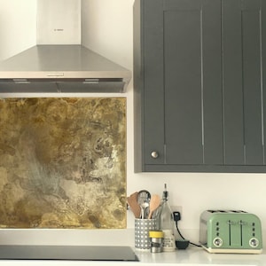 Aged brass backsplash for kitchen