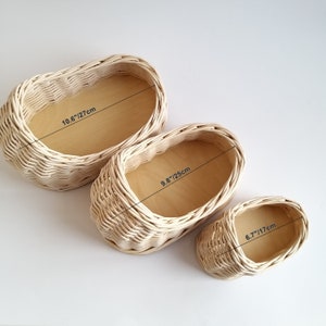 May include: Three woven wicker baskets in different sizes. The largest basket measures 10.6 inches or 27 centimeters. The middle basket measures 9.8 inches or 25 centimeters. The smallest basket measures 6.7 inches or 17 centimeters.