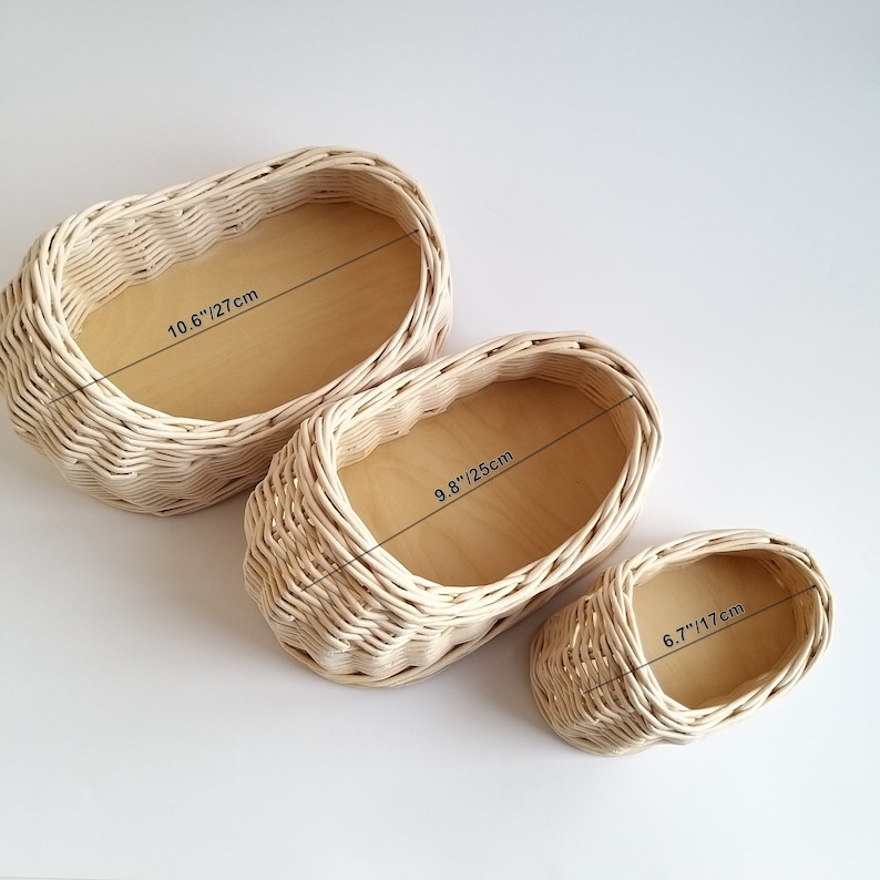 May include: Three woven wicker baskets in different sizes. The largest basket measures 10.6 inches or 27 centimeters. The middle basket measures 9.8 inches or 25 centimeters. The smallest basket measures 6.7 inches or 17 centimeters.