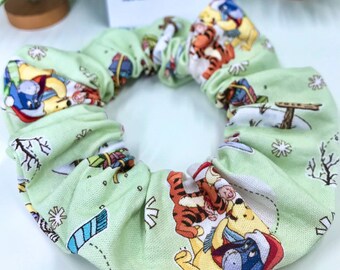 Disney Winnie The Pooh Christmas Scrunchies. Soft sage green cotton with Winnie & Friends enjoying Xmas! Handmade in Adelaide, Australia.