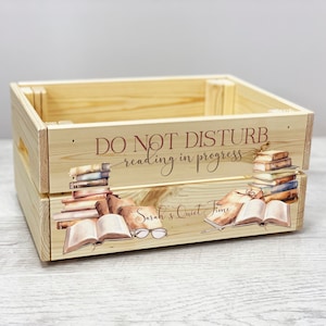 May include: A wooden crate with a printed design of books, glasses, and the text "Do Not Disturb, reading in progress, Sarah's Quiet Time".