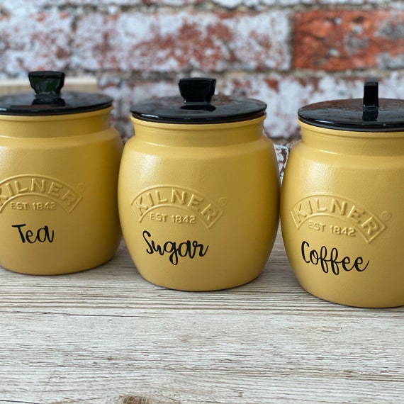 yellow tea coffee sugar canisters next