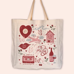 May include: Cream tote bag featuring a playful design in red and pink hues. The design incorporates a heart, airplane, butterflies, a house, a cassette tape, and text including "Ladies Room" and "I'm a little messy".