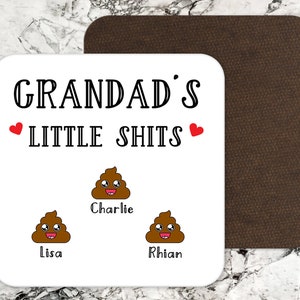 May include: White coaster with the text "Grandad's Little Shits" with two red hearts.  Below the text are three cartoon poop emojis with the names Charlie, Lisa, and Rhian.