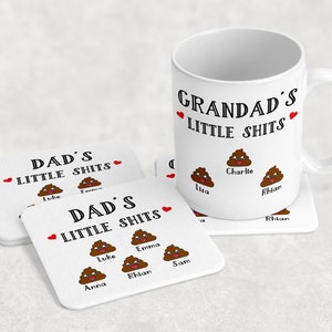 May include: White ceramic mug with the text "Grandad's Little Shits" and three cartoon poop emojis with the names "Lisa", "Charlie", and "Rhian" underneath.  Two white ceramic coasters with the text "Dad's Little Shits" and cartoon poop emojis with names underneath.