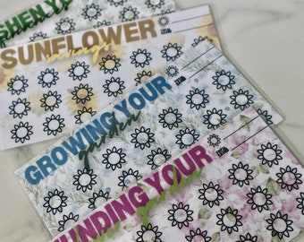May include: Three printable savings trackers with sunflower designs. The trackers are titled "Sunflower Savings", "Growing Your Garden", and "Funding Your Garden".