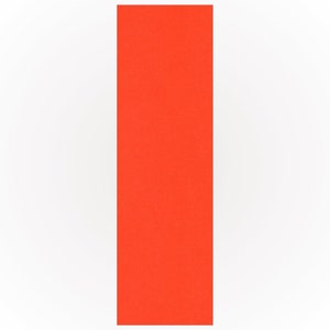 May include: A vertical, rectangular piece of bright orange paper against a white background. The paper has a textured surface and fills the right side of the frame.