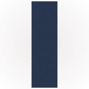 May include: A vertically-aligned, navy blue rectangular object with a textured surface, set against a white background. The object fills a large portion of the frame.