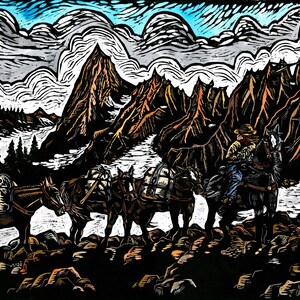 May include: A woodcut print depicts a cowboy on horseback leading a pack train through a mountain landscape. The print features a color palette of black, brown, and blue, with detailed depictions of the mountains, trees, and animals.
