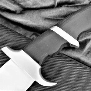 May include: A black and silver knife with a textured handle. The knife is lying on a black fabric background.