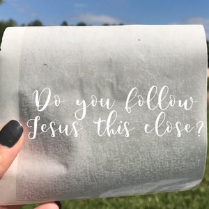 May include: A white piece of paper with the text "Do you follow Jesus this close?" written in cursive.