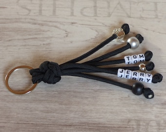 Keychain pocket dangler made of paracord Desired colors customizable with name pendant Key chain gift dog paw