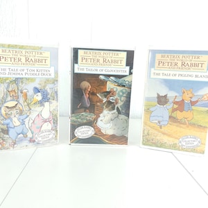May include: Three Beatrix Potter 'The World of Peter Rabbit' VHS tapes. The first tape features Tom Kitten and Jemima Puddle Duck. The second tape features The Tailor of Gloucester. The third tape features Pigling Bland.