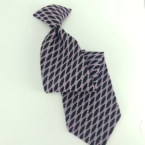 May include: A purple and black patterned tie with a clip-on design.