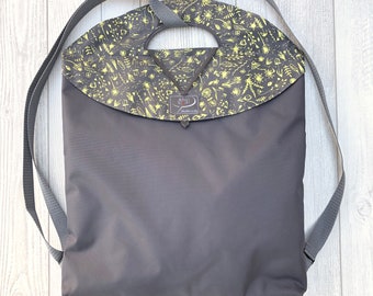 Large convertible gray backpack | foldable, water-repellent with interior pocket - charcoal canvas - light yellow floral pattern / beach bag