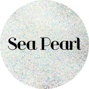 May include: A close-up of iridescent glitter with the text "Sea Pearl" in black.