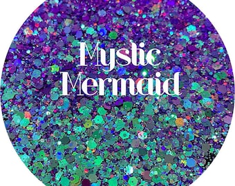 May include: A close-up of iridescent purple, green, and blue glitter with the text "Mystic Mermaid" in white.