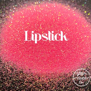 May include: A close-up of a pink glitter with iridescent shimmer. The glitter is labeled "Lipstick".