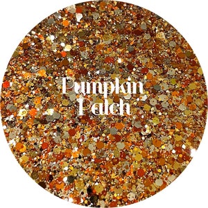 May include: Circular image of glitter with the text "Pumpkin Patch". The glitter is a mix of orange, gold, brown, and silver hexagonal shapes, creating a sparkling, textured effect. The overall theme suggests a fall or autumn aesthetic.