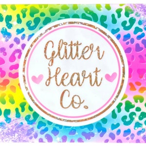 May include: A colorful rainbow and leopard print background with a white circle containing the text "Glitter Heart Co." in gold lettering with pink hearts on either side of the text.