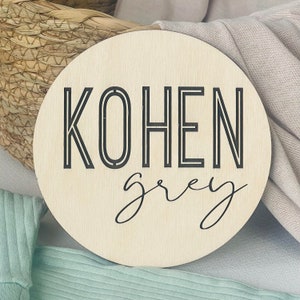 Baby announcement photo prop idea, personalized hospital name sign for newborn, engraved wood circle with baby name on front, unique gift