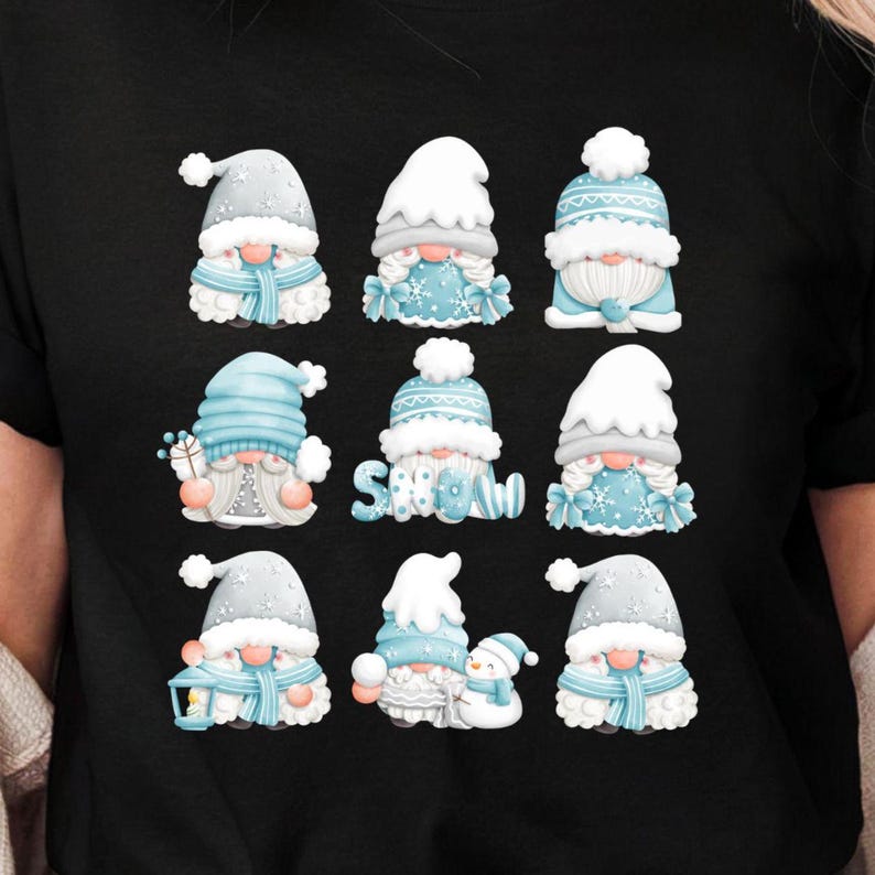 May include: A black t-shirt featuring a graphic print of nine winter gnomes arranged in a grid. The gnomes wear light blue and white hats, scarves, and winter clothing, with some holding lanterns or snowmen. The word SNOW is written in blue.