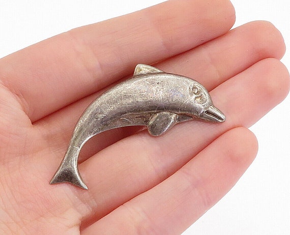 Dolphin brooch on sale