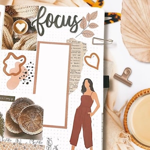 May include: A white planner page with brown and beige patterned paper, stickers, and drawings. The page has the word "focus" written in black cursive. There is a drawing of a person wearing a brown jumpsuit. The page is decorated with a brown leaf, a heart, and a brown and white patterned circle.