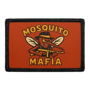 May include: Rectangular patch with a black border and an orange background. The patch features a cartoon mosquito wearing a fedora and holding a machine gun. The words "MOSQUITO MAFIA" are in yellow.
