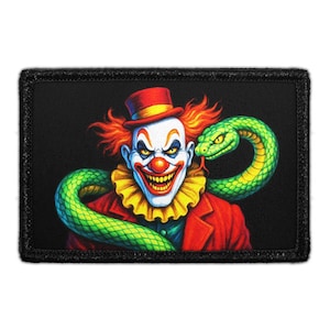 May include: A rectangular patch featuring a menacing clown with red hair, a red top hat, and a yellow ruffled collar. A green snake is wrapped around the clown's neck. The patch has a black border and background.