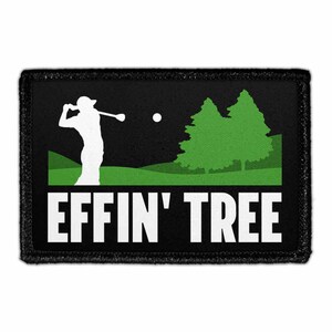 May include: A rectangular black patch featuring a white silhouette of a golfer swinging a club toward a golf ball. Below the golfer are green trees and a green hill. The text EFFIN' TREE is printed in large white capital letters at the bottom.
