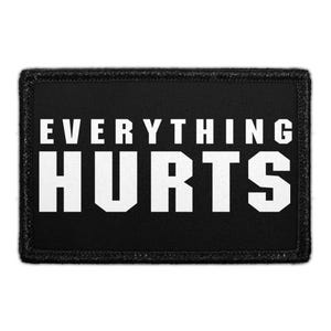 May include: Black rectangular patch with the words "EVERYTHING HURTS" in bold white capital letters. The patch has a black border with a textured appearance. The text is centered on the patch.