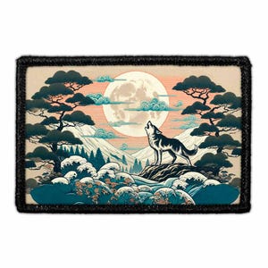 May include: A rectangular embroidered patch featuring a wolf howling at a large full moon. The scene includes stylized dark green pine trees, snow-capped mountains, and deep blue ocean waves with white foam, all framed by a thick black border.