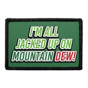 May include: A rectangular patch with a green background and black border. The text "I'M ALL JACKED UP ON MOUNTAIN DEW!" is displayed in white, green, and red, with a black outline.
