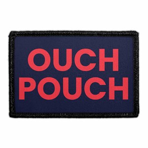 May include: A rectangular patch with the words "OUCH POUCH" in red block letters on a navy blue background. The patch has a black border.