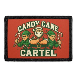 May include: A rectangular patch with a black border features a cartoon illustration. Santa Claus, with crossed arms, stands between two green elves, all holding candy canes. The text "CANDY CANE CARTEL" is arched above and below the figures.