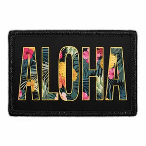 May include: A rectangular black patch with a gold-outlined border. The word ALOHA is printed in large, bold letters filled with a tropical pattern of green palm leaves, yellow pineapples, and vibrant pink and orange hibiscus flowers.