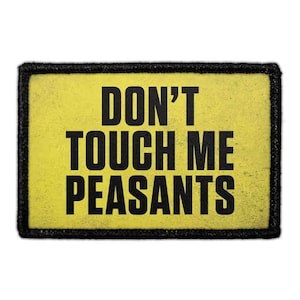 May include: A rectangular patch with a yellow background and a thick black border. The text DON'T TOUCH ME PEASANTS is printed in bold, black, sans-serif capital letters across the center of the patch, occupying three distinct lines.