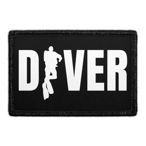 May include: A rectangular black patch with a white embroidered border. The word DIVER is printed in large white capital letters, with the letter I replaced by a white silhouette of a scuba diver wearing fins and gear, centered on the patch.