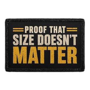 May include: A rectangular black patch with a stitched border featuring the text PROOF THAT in a distressed off-white font, followed by the text SIZE DOESN'T MATTER in a larger, distressed golden-yellow font, all set against a solid black background.