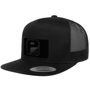 May include: Black snapback trucker hat with a mesh back and a flat brim. The hat features a rectangular patch with a stylized "P" logo. The hat has a curved brim and a snap closure for adjustable sizing.