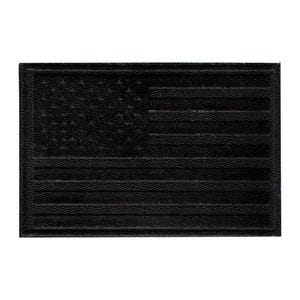 May include: A rectangular, black patch featuring the embossed design of the American flag. The flag's stars and stripes are clearly defined, creating a textured appearance. The patch is likely made of a durable material.