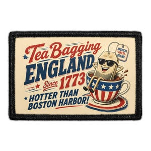 May include: A rectangular patch with a black border featuring a cartoon tea bag wearing sunglasses sitting in a teacup decorated with stars and stripes. The text reads: Tea Bagging ENGLAND Since 1773 HOTTER THAN BOSTON HARBOR! and America's Finest Blend.