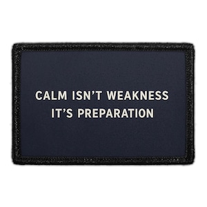 May include: A rectangular navy blue patch with the text "CALM ISN'T WEAKNESS IT'S PREPARATION" in white. The patch has a black border.
