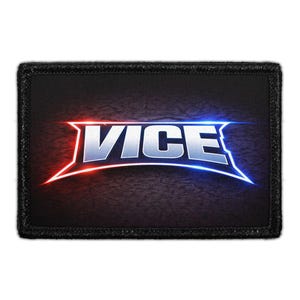 May include: A rectangular patch with the word "VICE" in white, outlined with red and blue neon-style accents. The background is dark with a textured appearance, and the patch has a black border.