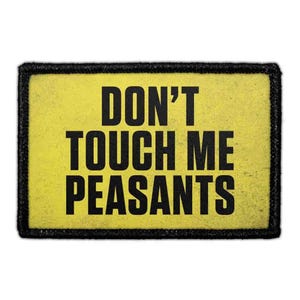 May include: A rectangular patch with a yellow background and a thick black border. The text DON'T TOUCH ME PEASANTS is printed in bold, black, sans-serif capital letters across the center of the patch, occupying three distinct lines.